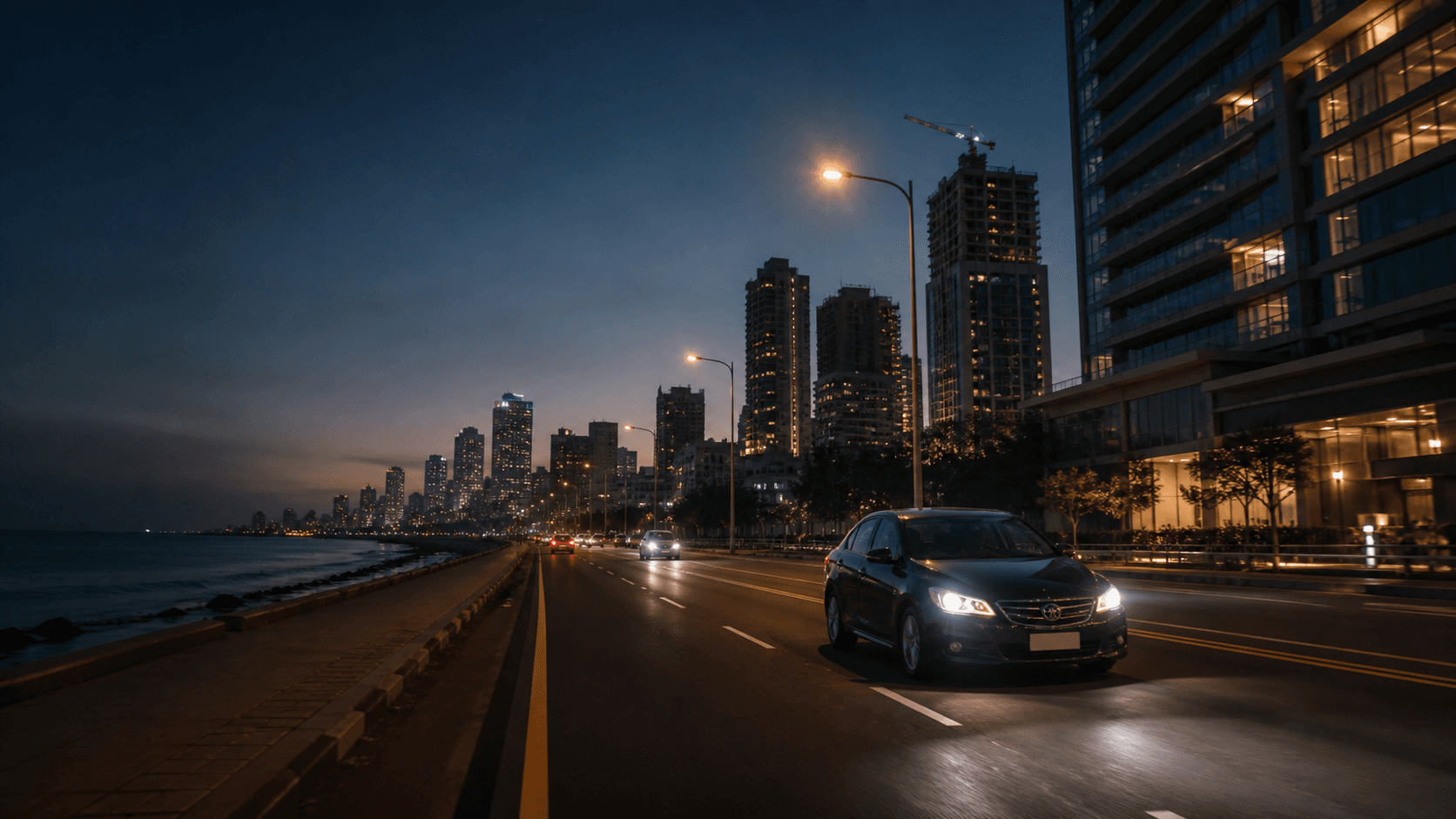 Vehicle travelling through Colombo at dusk
